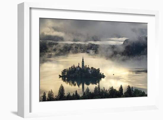 Europe, Slovenia, Bled - A Pletna Boat Arriving At The Island Of Lake Bled During A Foggy Sunrise-Aliaume Chapelle-Framed Photographic Print