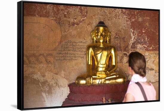 European Tourist Looking at Golden Buddha Statue in Bagan, Myanmar-Harry Marx-Framed Stretched Canvas