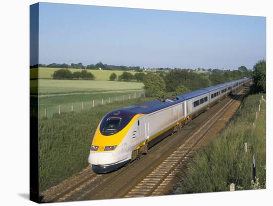 Eurostar Train Travelling Through Countryside-John Miller-Stretched Canvas