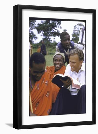 Evangelist Billy Graham Showing His Bible to the Waarusha Warriors Near Mt. Meru-James Burke-Framed Photographic Print