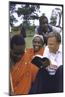 Evangelist Billy Graham Showing His Bible to the Waarusha Warriors Near Mt. Meru-James Burke-Mounted Photographic Print