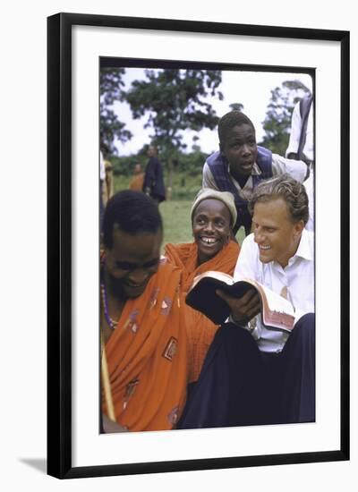 Evangelist Billy Graham Showing His Bible to the Waarusha Warriors Near Mt. Meru-James Burke-Framed Photographic Print