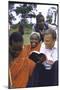 Evangelist Billy Graham Showing His Bible to the Waarusha Warriors Near Mt. Meru-James Burke-Mounted Photographic Print