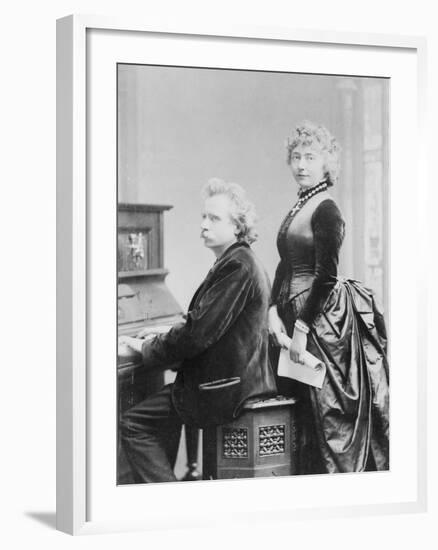 Evard Grieg Playing Piano with Wife Looking On-null-Framed Photographic Print