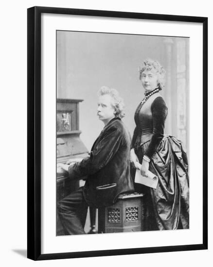 Evard Grieg Playing Piano with Wife Looking On-null-Framed Photographic Print