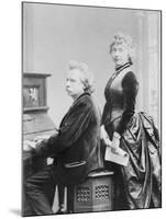 Evard Grieg Playing Piano with Wife Looking On-null-Mounted Photographic Print