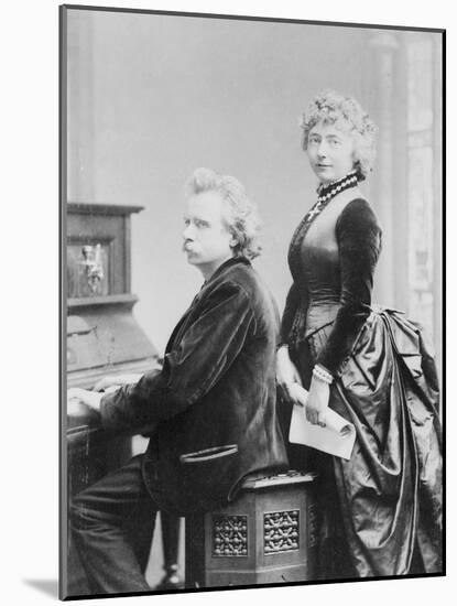 Evard Grieg Playing Piano with Wife Looking On-null-Mounted Photographic Print