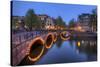 Evening Light Old Buildings and Bridge Along the Many Canals of Amsterdam, Netherlands-Darrell Gulin-Stretched Canvas