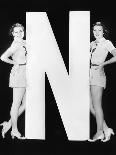 Two Young Women Posing with the Letter T-Everett Collection-Photographic Print