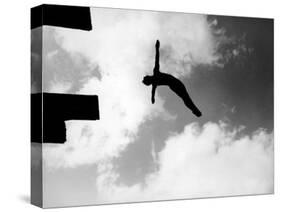 Excellent of Man Silhouetted Against Sky Doing Back Dive Off High Board-Rex Hardy Jr.-Stretched Canvas