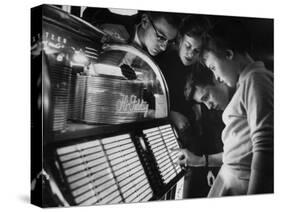 Exchange Student Stephen Lapekas Playing a Song on a Juke Box-null-Stretched Canvas