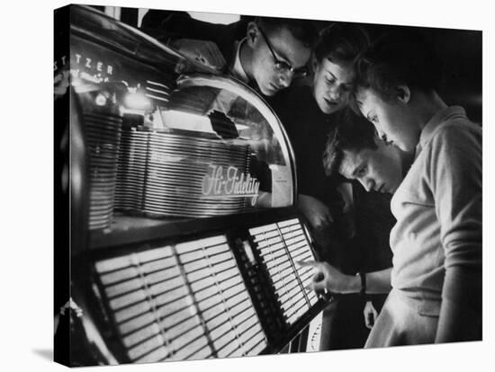Exchange Student Stephen Lapekas Playing a Song on a Juke Box-null-Stretched Canvas