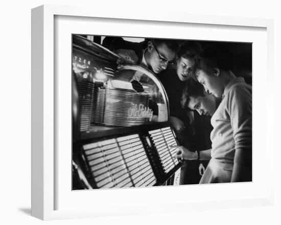 Exchange Student Stephen Lapekas Playing a Song on a Juke Box-null-Framed Photographic Print