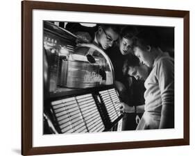 Exchange Student Stephen Lapekas Playing a Song on a Juke Box-null-Framed Photographic Print