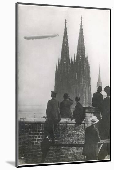 Excited Spectators Watching a Zeppelin Z111 Fly Over Cologne Cathedral Germany-null-Mounted Photographic Print