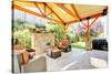 Exterior Covered Patio with Fireplace and Furniture-Iriana Shiyan-Stretched Canvas
