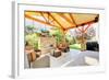Exterior Covered Patio with Fireplace and Furniture-Iriana Shiyan-Framed Photographic Print