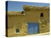 Exterior of an Adobe House with a Tile Roof and Blue Door, Salamanca, Castile Leon, Spain-Michael Busselle-Stretched Canvas