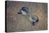 Eyeglasses Laying on a Grungy Wooden Background with Retro Filter Effect-Diplomedia-Stretched Canvas