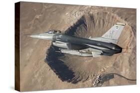 F-16C Fighting Falcon Flying Above Arizona's Meteor Crater-null-Stretched Canvas