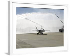 F-18 Aircraft Taxies Beneath the Spray from Fire Trucks-Stocktrek Images-Framed Photographic Print