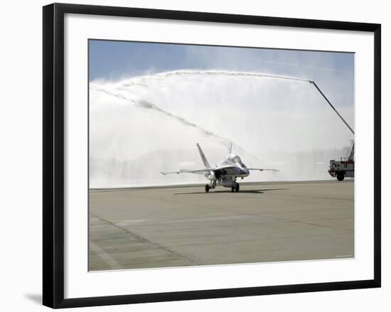 F-18 Aircraft Taxies Beneath the Spray from Fire Trucks-Stocktrek Images-Framed Photographic Print