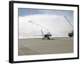 F-18 Aircraft Taxies Beneath the Spray from Fire Trucks-Stocktrek Images-Framed Photographic Print