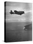 F-6 Hellcat Fighter Plane over Tanahmera Bay as Japanese Airfields at Hollandia, New Guinea-J^ R^ Eyerman-Stretched Canvas