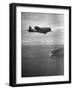 F-6 Hellcat Fighter Plane over Tanahmera Bay as Japanese Airfields at Hollandia, New Guinea-J^ R^ Eyerman-Framed Photographic Print