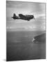 F-6 Hellcat Fighter Plane over Tanahmera Bay as Japanese Airfields at Hollandia, New Guinea-J^ R^ Eyerman-Mounted Photographic Print