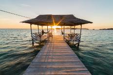 Tourist Sitting on Wooden Jetty While Watching a Stunning Sunrise on the Sea. Togean (Or Togian) Is-Fabio Lamanna-Premium Photographic Print