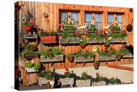 Facade of a Farmhouse decorated with Flowers, Beatenberg, Canton of Bern, Switzerland-null-Stretched Canvas