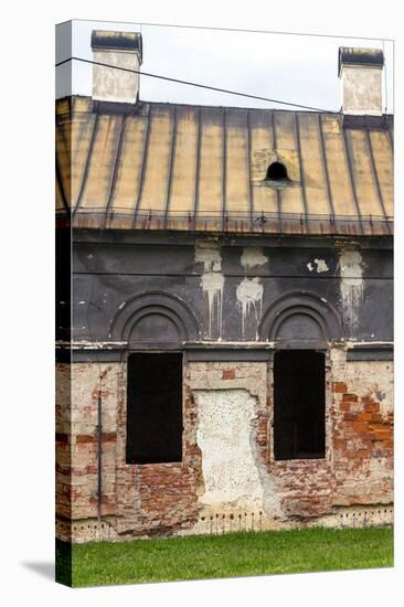 Facade of Old Abandoned House with Dark Windows in Slovakia-alexabelov-Stretched Canvas