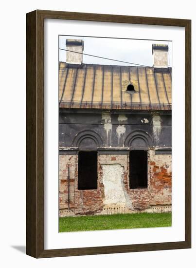 Facade of Old Abandoned House with Dark Windows in Slovakia-alexabelov-Framed Photographic Print