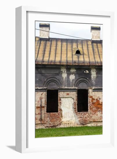 Facade of Old Abandoned House with Dark Windows in Slovakia-alexabelov-Framed Photographic Print