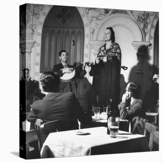 "Fado" Singer and a Guitarist Entertaining the Audience in the Lisbon Nightclub-Bernard Hoffman-Stretched Canvas
