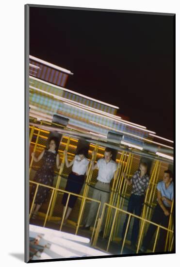 Fairgoers on a 'Round-Up' Spinning Amusement Ride at the Iowa State Fair, Des Moines, Iowa, 1955-John Dominis-Mounted Photographic Print