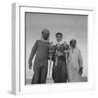 Falcon Trainers Holding onto Posts While their Birds Perch Atop Them-Bob Landry-Framed Photographic Print