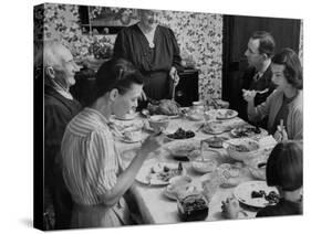 Family Eating at Dinner Table-John Dominis-Stretched Canvas