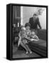 Family Group Looking at a Brochure, Doncaster, South Yorkshire, 1963-Michael Walters-Framed Stretched Canvas