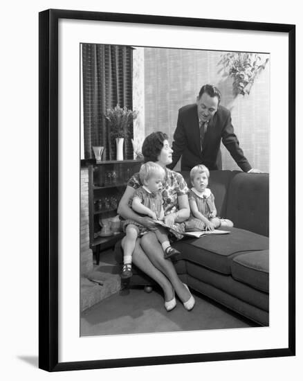 Family Group Looking at a Brochure, Doncaster, South Yorkshire, 1963-Michael Walters-Framed Photographic Print