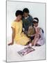 Family Group Looking at a Magazine, 1963-Michael Walters-Mounted Photographic Print