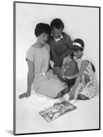 Family Group Looking at a Magazine, 1963-Michael Walters-Mounted Photographic Print