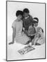 Family Group Looking at a Magazine, 1963-Michael Walters-Mounted Photographic Print