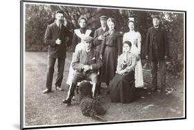 Family Group with Black Poodle in a Garden-null-Mounted Photographic Print