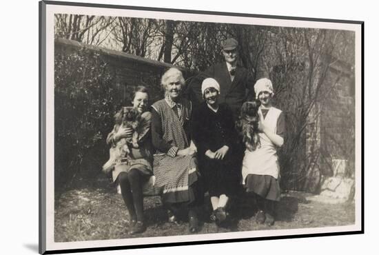 Family Group with Two Dogs in a Garden-null-Mounted Photographic Print