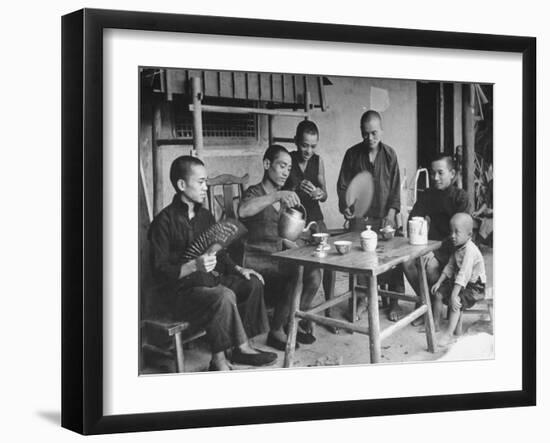 Family Having Tea in Courtyard-Carl Mydans-Framed Photographic Print