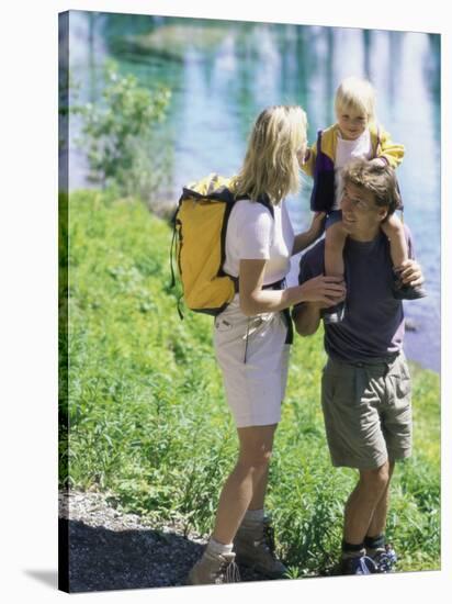 Family Hiking by a Pond-null-Stretched Canvas