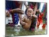 Family Members Give Bath to a Child after a Mundan or Head Tonsured Ceremony-null-Mounted Photographic Print