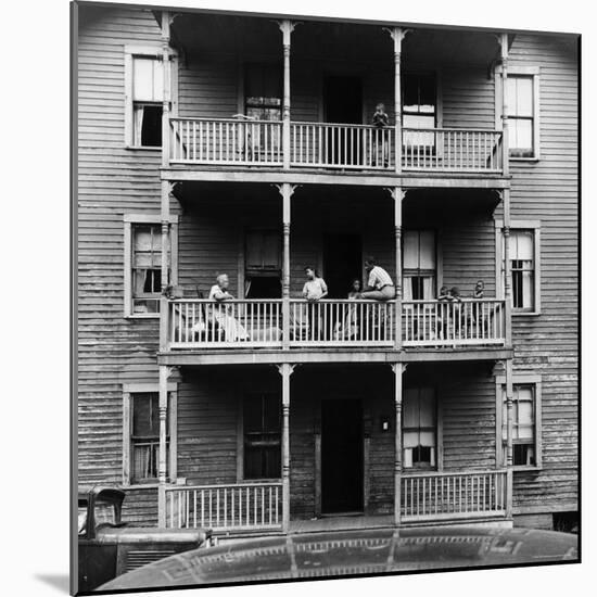 Family on Balcony of Apartment Building-Gordon Parks-Mounted Photographic Print